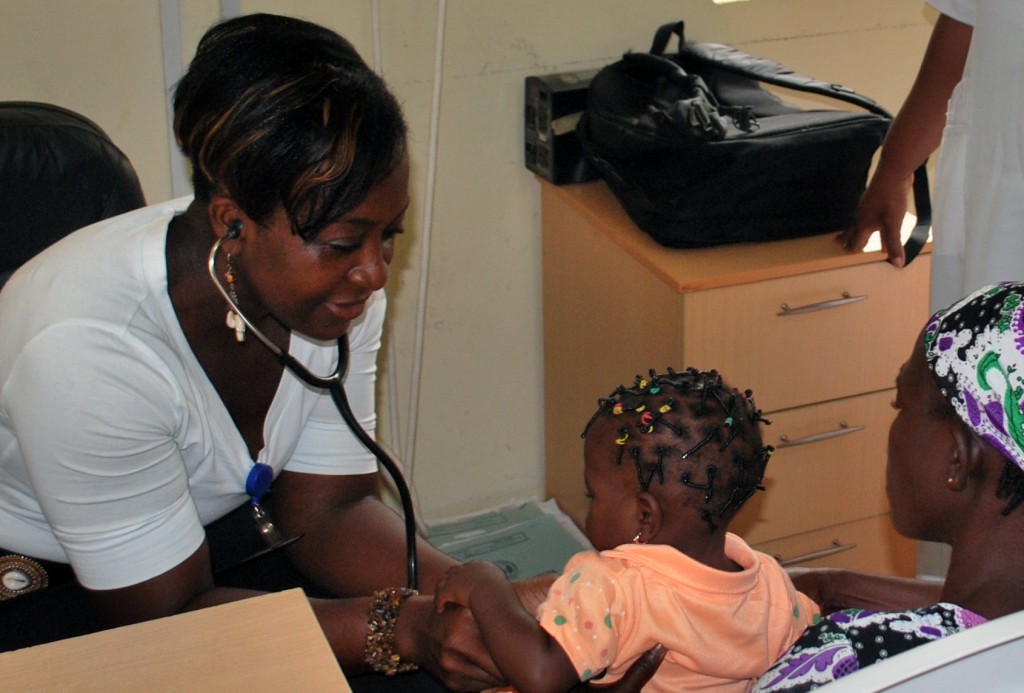 "I crafted my career choice to benefit African children!" Dr. Nadia Sam-Agudu is examining an HIV exposed baby